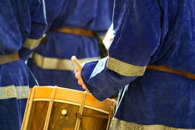 Close-up of hands playing drum