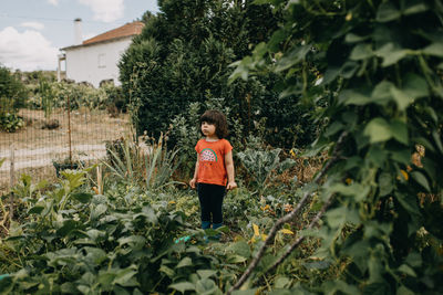 Cute girl standing in the garden