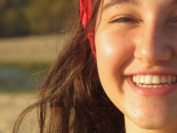 Close-up portrait of smiling teenage girl