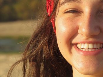 Close-up portrait of a smiling young woman