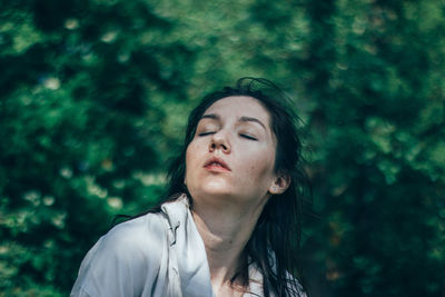 Woman dancing in forest