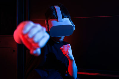 Gamer man wearing virtual reality goggles