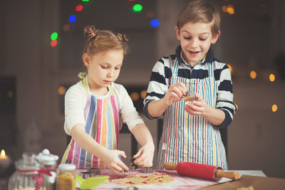 Cute girl having food in kitchen