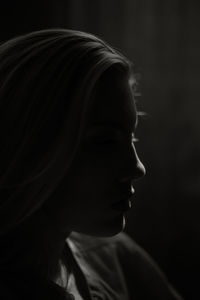 A young woman sitting in home isolated