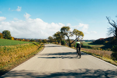 Bicycle on road against sky