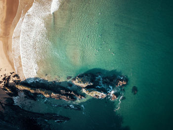 High angle view of rocks in sea