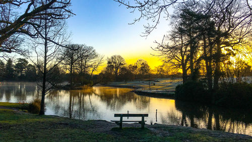 Scenic view of lake against sky during sunset