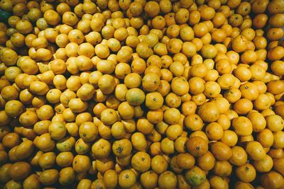 Full frame shot of orange fruits at market for sale