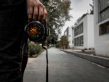 Close-up of man holding camera