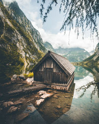 Built structure amidst trees and buildings against sky