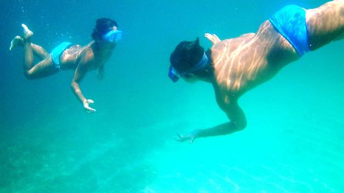 People swimming in sea