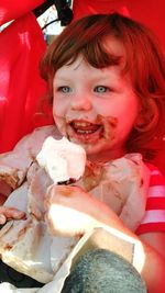 Portrait of cute girl holding ice cream