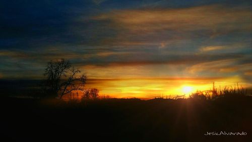 Scenic view of dramatic sky during sunset