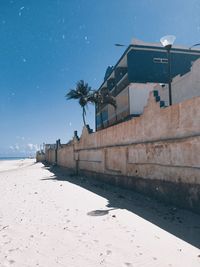 Building by sea against sky