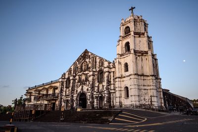 Exterior of daraga church against clear sky at dusk