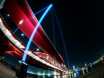 Low angle view of illuminated ferris wheel at night