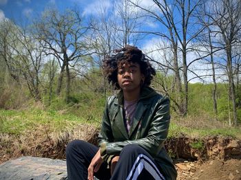 Portrait of woman sitting outdoors