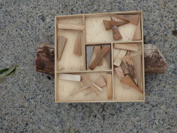 High angle view of box on wood