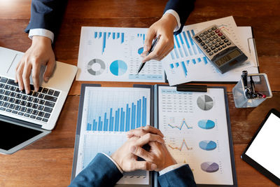 High angle view of business people working on table