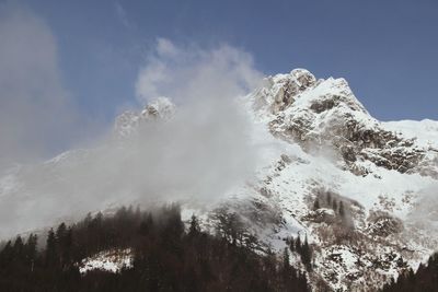 Scenic view of snow covered mountains