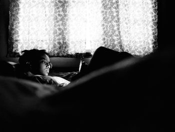 Boy resting on sofa at home