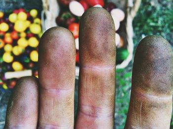 Cropped image of dirty fingers