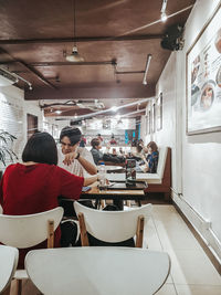 Rear view of people working in restaurant