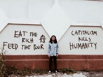 Woman standing on wall