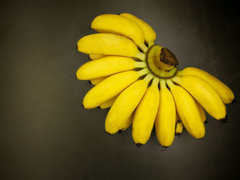 Directly above shot of yellow fruit against white background