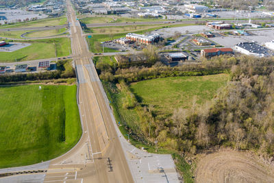 High angle view of road amidst trees on landscape