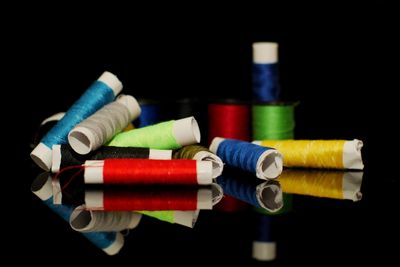 Close-up of colored pencils against black background