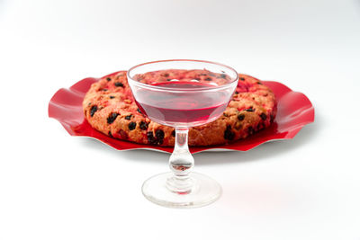 High angle view of drink on table against white background