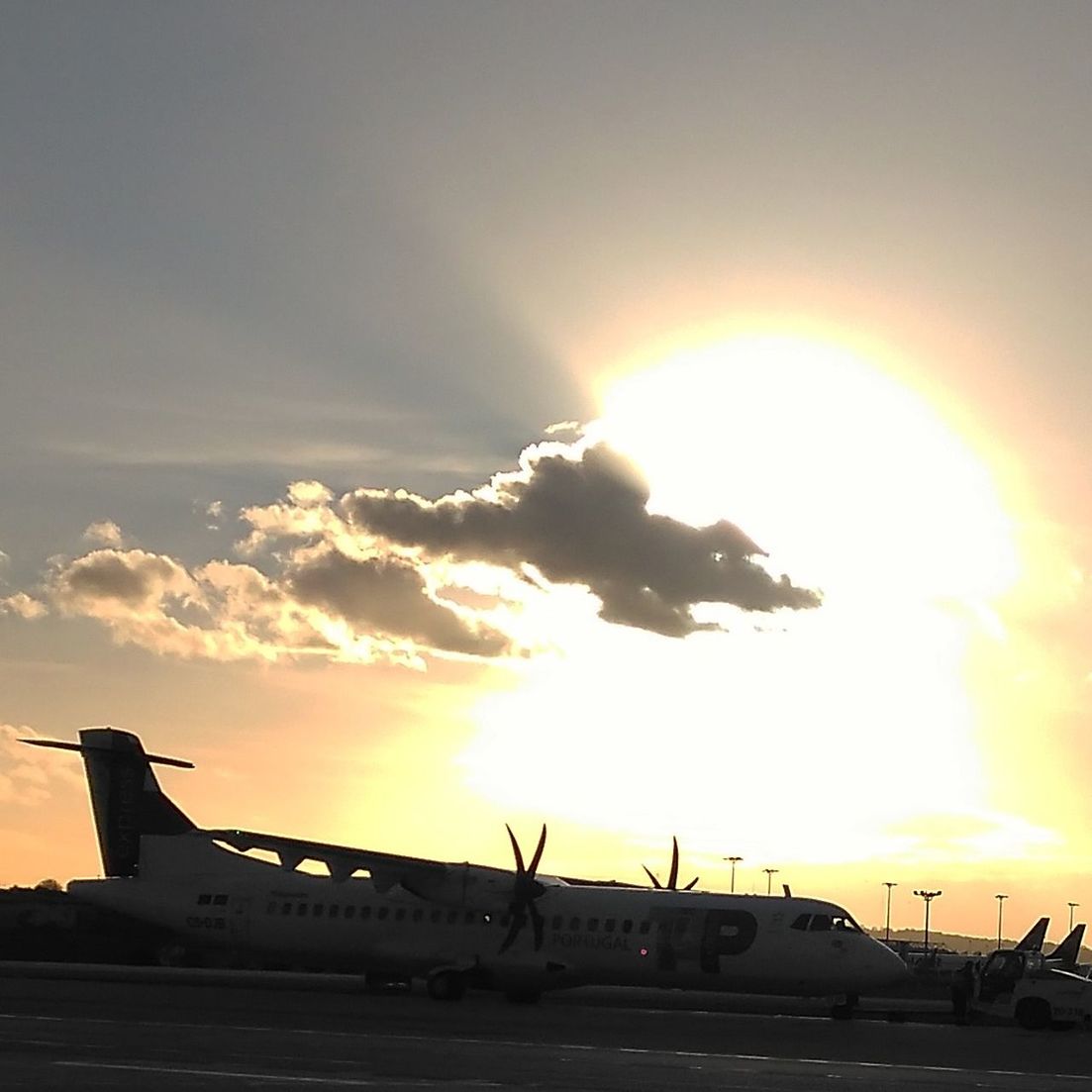 sunset, sun, sky, transportation, airplane, cloud - sky, mode of transport, sunlight, air vehicle, sunbeam, lens flare, travel, no people, airport, outdoors, runway, airport runway, nature, military, commercial airplane, day