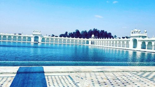 View of swimming pool against clear blue sky