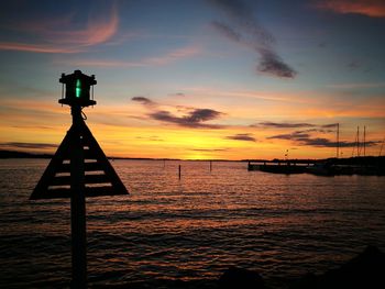 Scenic view of calm sea at sunset