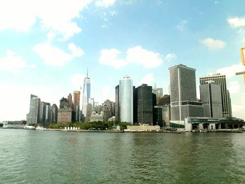 City skyline against cloudy sky