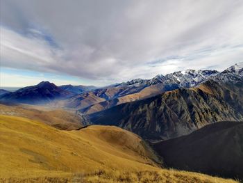 Scenic view of snowcapped mountains against sky