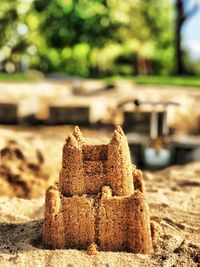 Close-up of cake on sand