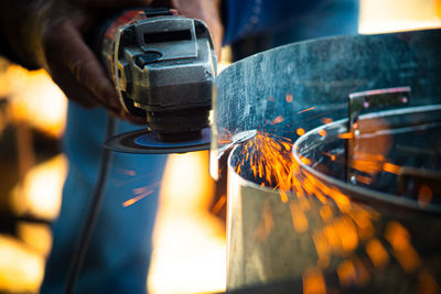 Midsection of man repairing car