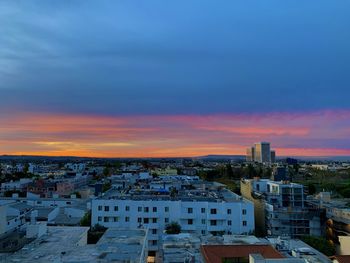 High angle view of townscape against sky during sunset