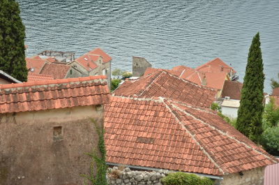 High angle view of townscape by sea