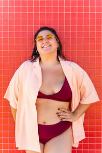 Portrait of young woman in bathtub