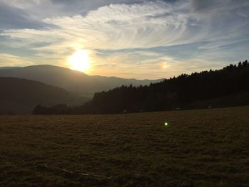 Scenic view of landscape at sunset