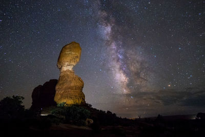 Low angle view of rock formation against sky