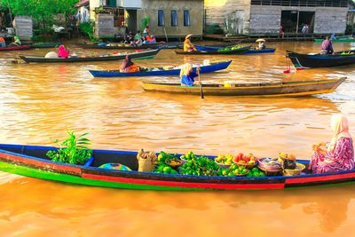 Boats moored in lake