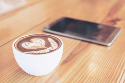 Close-up of coffee cup on table