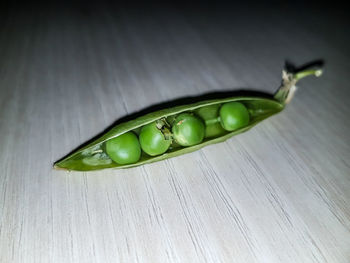 Close-up of green chili pepper on table