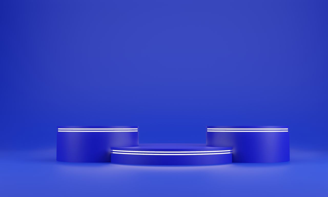 CLOSE-UP OF ILLUMINATED LAMP AGAINST BLUE BACKGROUND