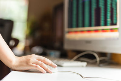 Midsection of woman using computer 