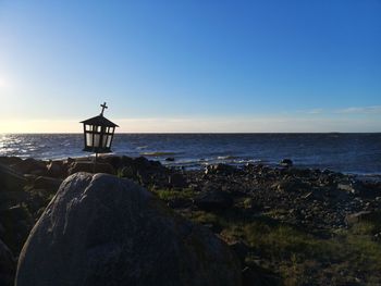 Scenic view of sea against clear blue sky